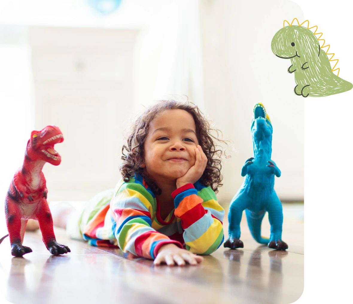 Child with toy dinosaurs indoors